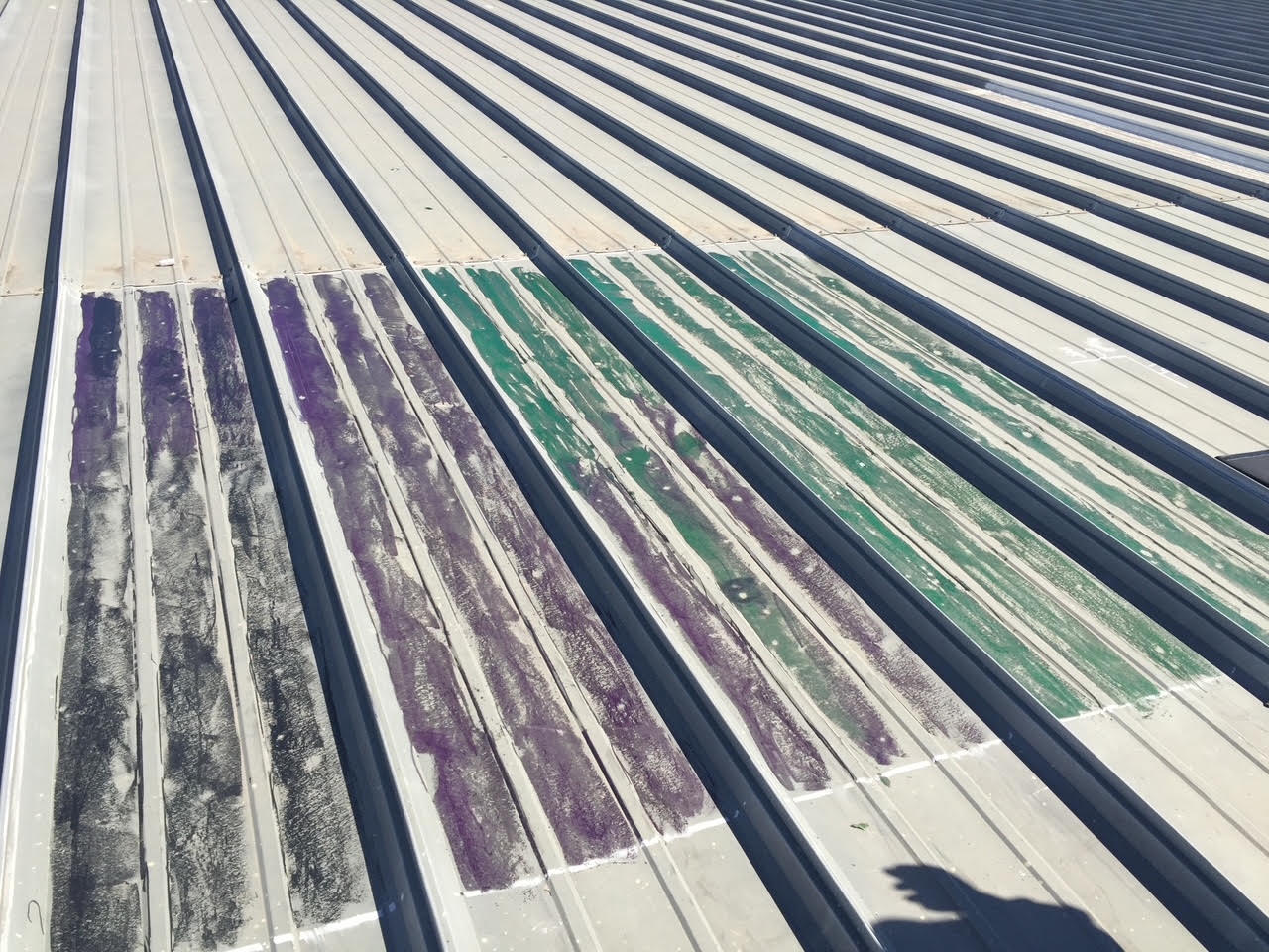 Marked inspection areas on a commercial metal roof