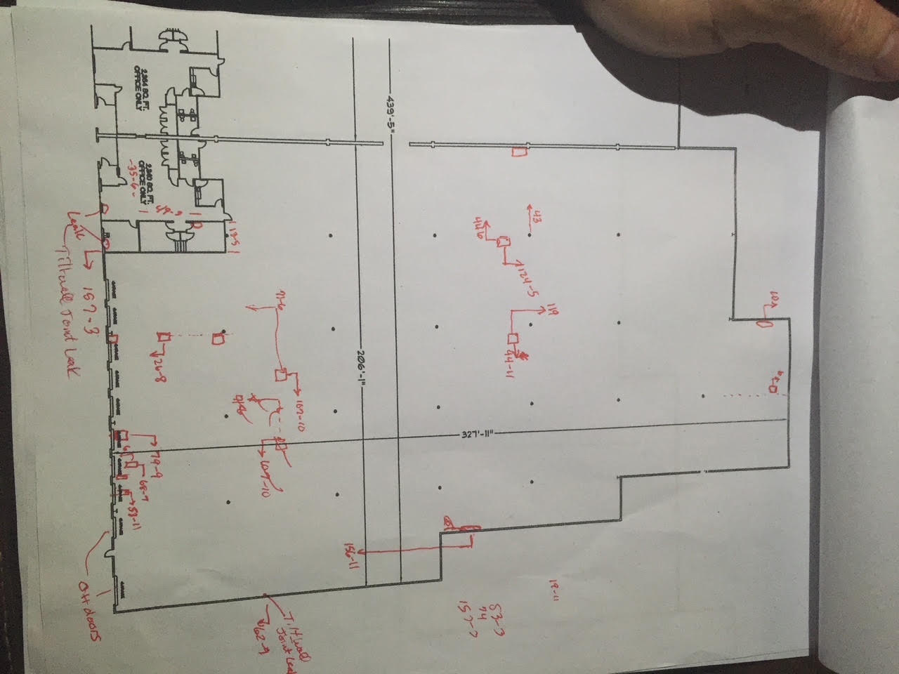 Annotated commercial building plan documenting leak locations