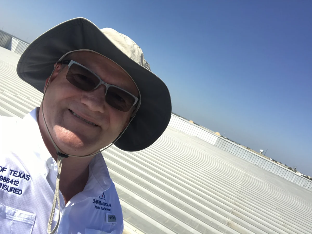 Cord Largo on a commercial rooftop during a Laredo inspection